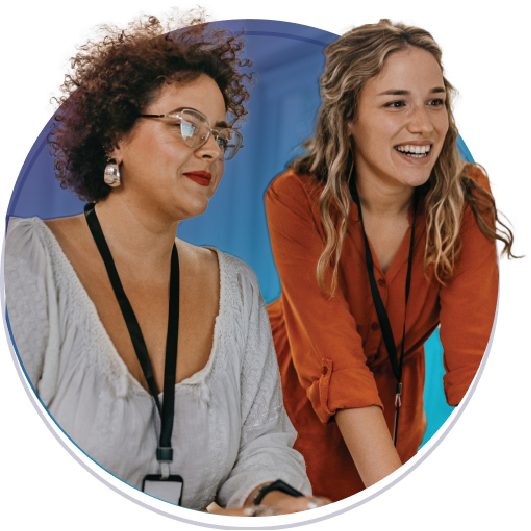 Women working together, looking at a laptop